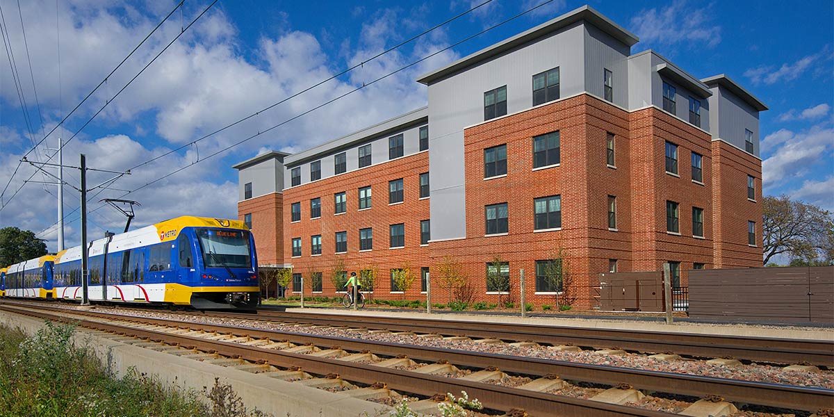 Apartment building with light-rail train