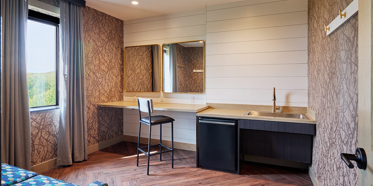 room with chair and mirrors