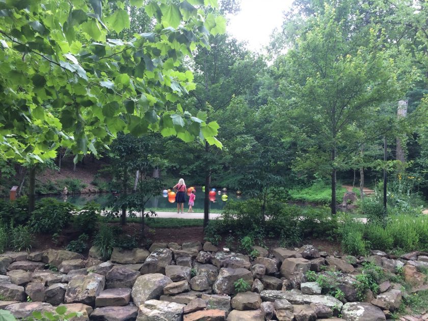 image of woman and child at a pond