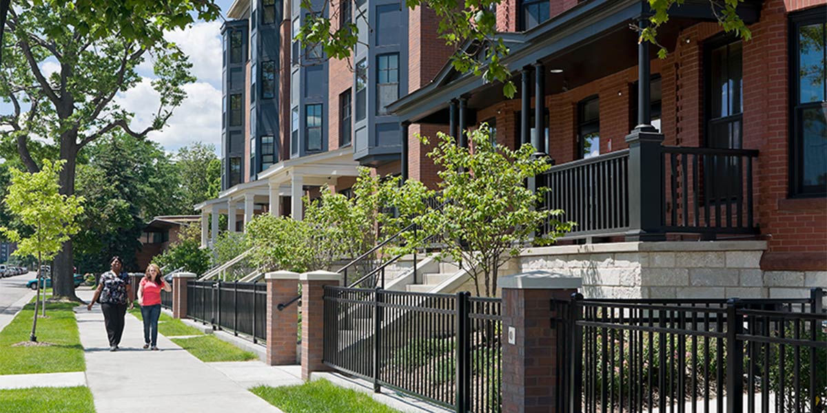 Apartment front street with people