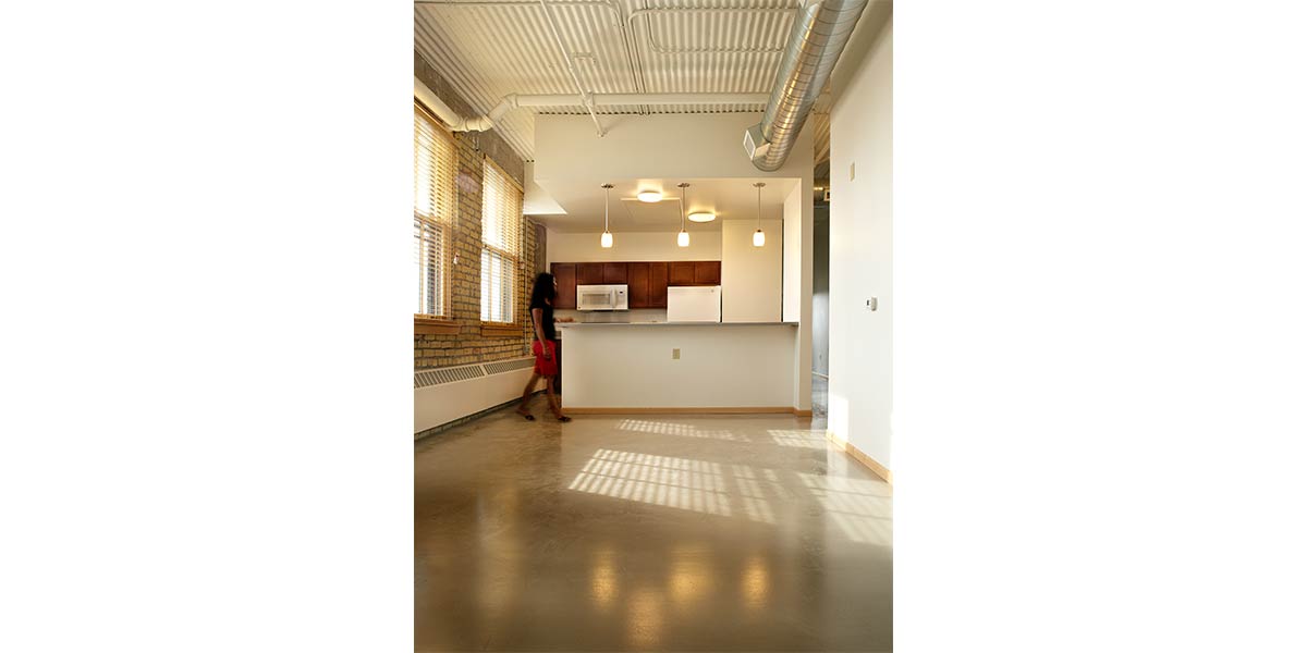 Kitchen in unit at renaissance box with women walking