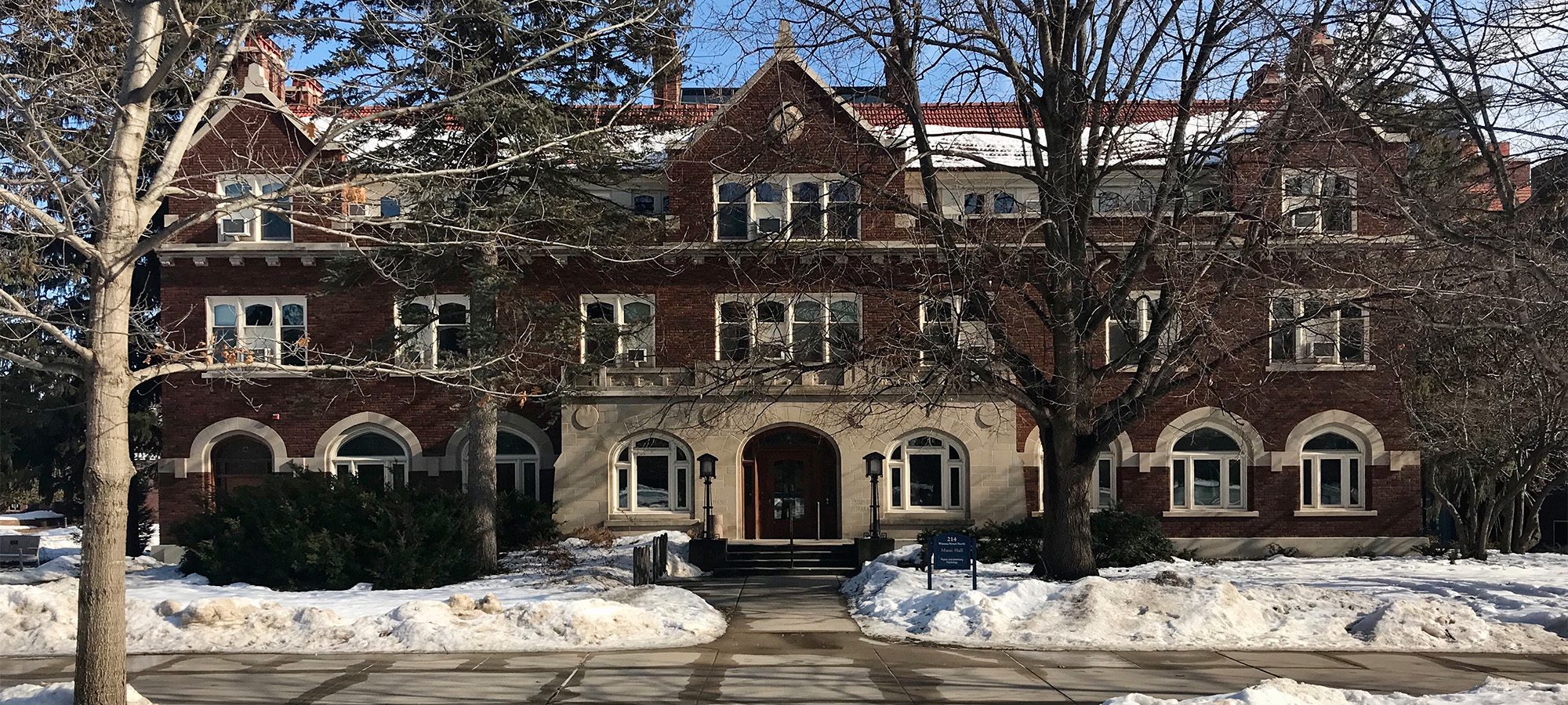 three story building with stone and brick exterior