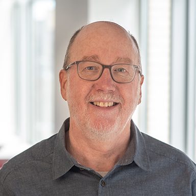 portrait of man in gray shirt
