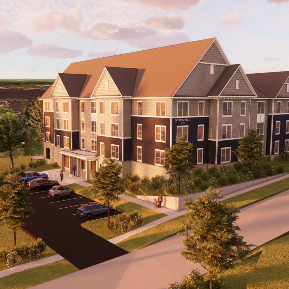 Multistory apartment building exterior at sunset
