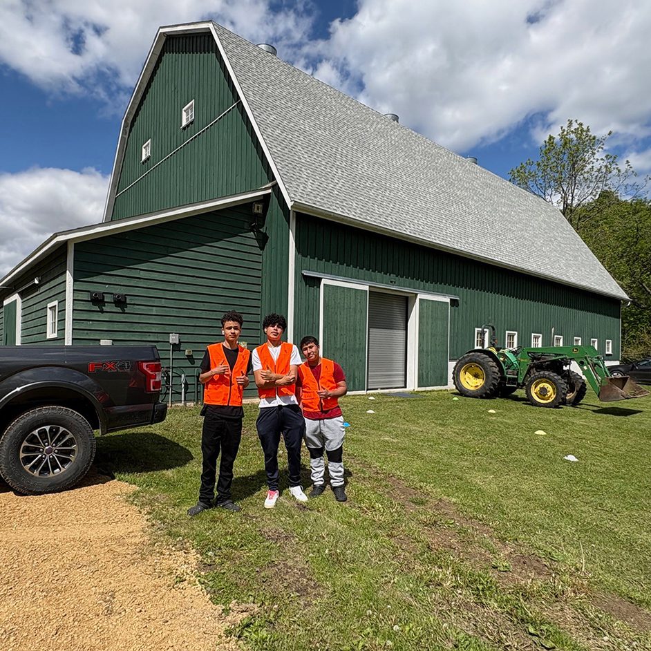 kids in front of barn