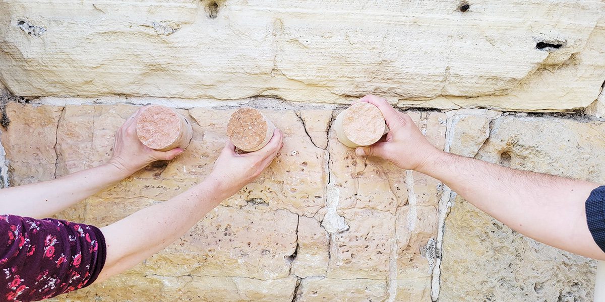 Hands on stone bridge